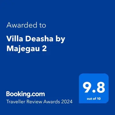 a screenshot of a cell phone with the text awarded to villa desasia by at Villa Majegau 2 Seminyak in Seminyak