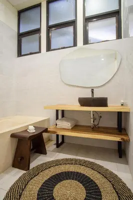 a bathroom with a sink and a mirror at Villa Maxima by Maheswara in Canggu