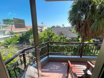 a view from the balcony of a condo at Beach Apartment inside Resort Walking Distance to the beach in Seminyak