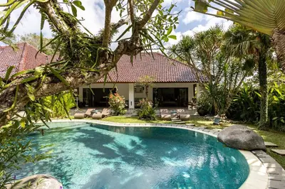 a swimming pool in the yard of a house at Villa Permata Umalas - Relaxing Tropical Oasis in Seminyak