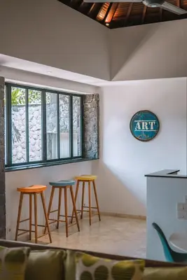 a group of stools in a room with a window at Villa Kalila: Elegant 2 BR Villa in Perfect Location ! in Seminyak