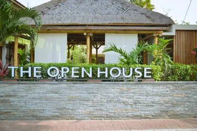 a sign that reads the open house in front of a house at The Open House Jimbaran Bali in Jimbaran