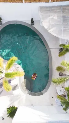 an overhead view of a swimming pool in a building at Villa Weiss Berawa in Canggu