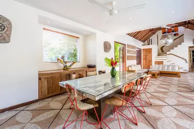 a dining room with a table and chairs at Villa Ku Tama by Villa Finder in Seminyak