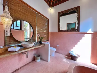 a bathroom with a sink and a mirror at Villa Nicole 5BR Paradise, quiet area in Central Oberoi Seminyak in Seminyak