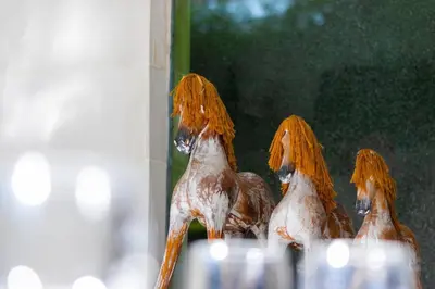 a reflection of three dolls with red hair in a mirror at Superb 3 Bed Villa, Walk to Beach, Fast Wi-Fi, in Seminyak
