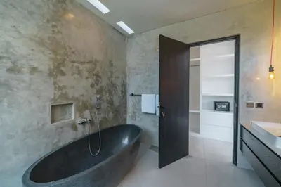 a bathroom with a large tub and a sink at Villa Vantage 7 - Outstanding 3 BR Villa - Great Location! in Canggu