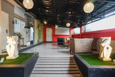 a lobby with two statues of cats on the floor at Kos 168 Jimbaran in Jimbaran