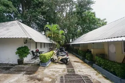 a couple of motorcycles parked next to a building at Kos 168 Jimbaran in Jimbaran