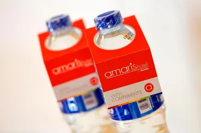 two bottles of antichristosed liquids sitting next to each other at Amaris Hotel Dewi Sri - Bali in Legian