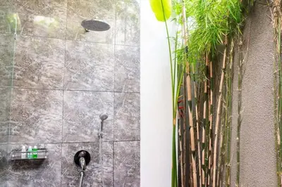 a shower stall with plants on the wall at Fantastic 3 Bed Villa, Walk to Beach, Sunny Pool in Seminyak