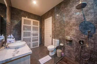 a bathroom with a sink and a toilet and a shower at Fantastic 3 Bed Villa, Walk to Beach, Sunny Pool in Seminyak