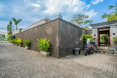 a motorcycle parked in front of a building at 4BR w/ Pool- Ultimate Comfort in Umalas in Kerobokan