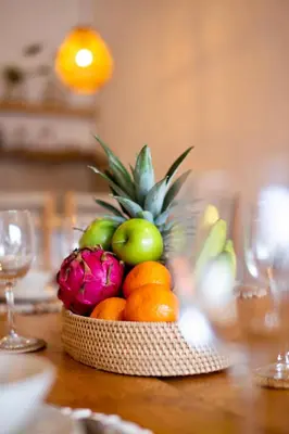 a basket of fruit sitting on a table at Simple & Magical Villas PRAYA in Seminyak