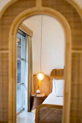 a bedroom with a bed and a window at Simple & Magical Villas PRAYA in Seminyak