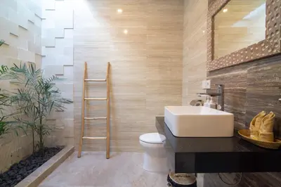 a bathroom with a sink and a toilet and a mirror at Simple & Magical Villas. Villa Sambali llI in Seminyak