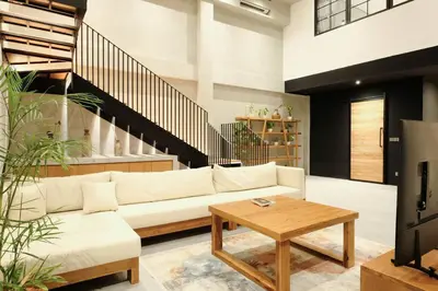 a living room with a white couch and a table at Manresa Villa Bali 2 in Canggu