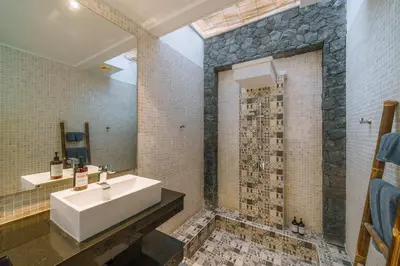 a bathroom with a sink and a shower at Villa Yasmee : Cozy and Modern 2 BR w/ Pool in Seminyak ! in Seminyak