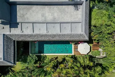 an overhead view of a swimming pool next to a house at Villa Alopa 1 in Seminyak