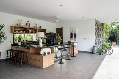 a kitchen with a island with a counter top at Villa Alopa 1 in Seminyak