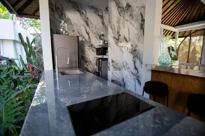 a kitchen with a sink and a counter top at Villa Loba in Seminyak