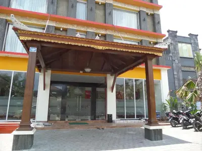 a building with a pavilion in front of it at Alkyfa Hotel Bali in Denpasar
