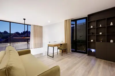 a living room with a couch and a table at The Oasis Smart Villa in Canggu