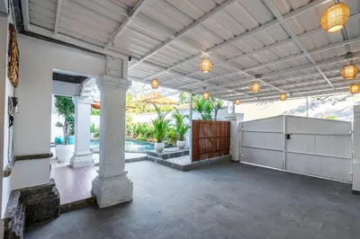 an outdoor patio with a pool and a pavilion at Villa Sky View - Seminyak in Seminyak