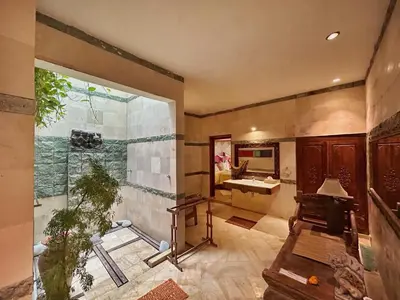 a large bathroom with a sink and a shower at The Chand Villa - A Hidden Gem in Petitenget in Seminyak