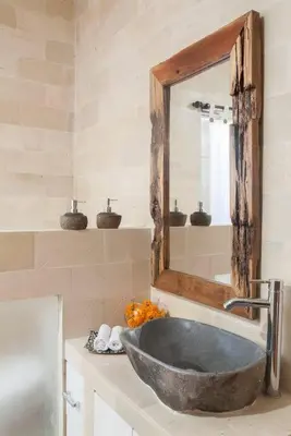 a bathroom with a sink and a mirror at Selog Villa 2 in Seminyak