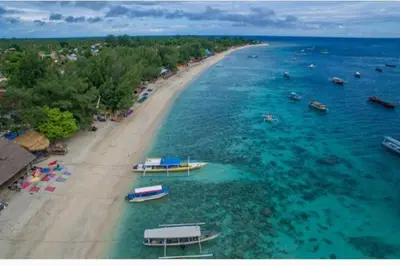 an aerial view of a beach with boats in the water at Selog Villa 2 in Seminyak