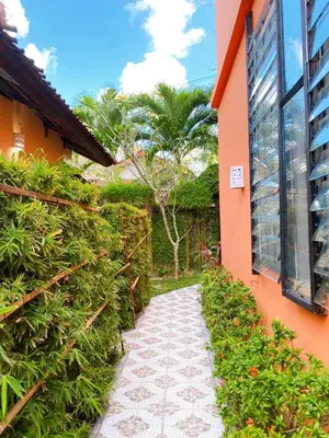 a walkway in front of a building with plants at Villa Kinandari Bukit Jimbaran in Jimbaran