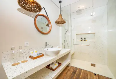 a white bathroom with a sink and a shower at Villa ElyOs Canggu by Nagisa Bali in Canggu