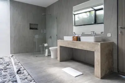 a bathroom with a sink and a shower and a toilet at LOTUS - Bali Invest Club in Kerobokan
