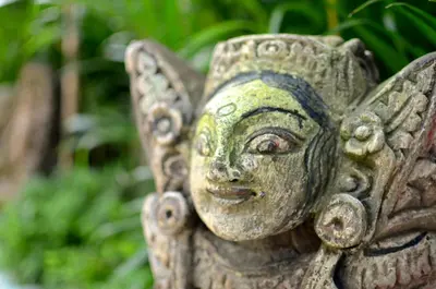 a statue of a butterfly with a face on it at Room & Vespa 1 - Stay Central Seminyak Near Beach in Seminyak