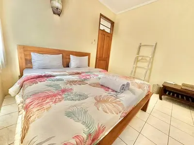 a bedroom with a large bed with at kuta 5BR private villa pool ,near airport, in Kuta
