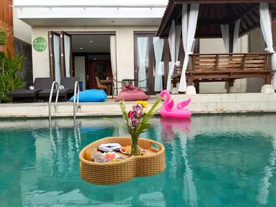 a wicker basket with a plant in the middle of a swimming pool at Casa de Prospera - 3BR Villa with Private Pool in Nusa Dua