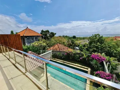 a balcony of a house with a swimming pool at Casa de Prospera - 3BR Villa with Private Pool in Nusa Dua