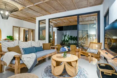 a living room with a couch and a table at Villa Aarna - Tropical Chic Private Oasis in Seminyak in Seminyak