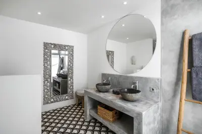 a bathroom with two sinks and a mirror at Villa Surga Julie by Alfred in Bali in Seminyak