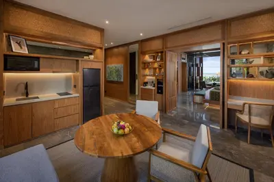 a kitchen and dining room with a table and chairs at Sumitra Luxury Villas & Resort by Pramana in Sanur