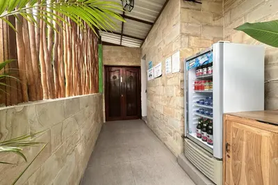 a hallway with a refrigerator in a room at Mora Residence Jimbaran in Jimbaran