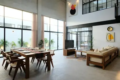 a large living room with a table and a couch at Manresa Villa Bali 3 in Canggu