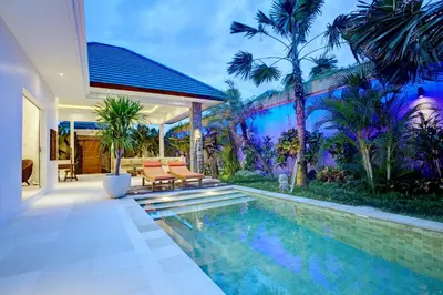 a swimming pool in the backyard of a house at Villa Jonas seminyak Bali in Seminyak