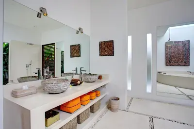 a bathroom with two sinks and a bath tub at Villa Jonas seminyak Bali in Seminyak