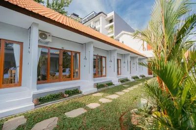 a facade of a house with a row of windows at Pondok Puspa Sumekar in Seminyak