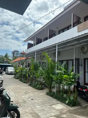 a building with a bunch of plants in front of it at Pondok Puspa Sumekar in Seminyak