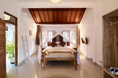 a bedroom with a bed in a room at Villa Santai, huge garden Seminyak square in Seminyak