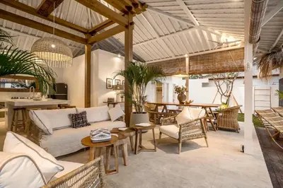 a living room with a couch and a table at A Casa Di Renucci by Alfred in Bali in Seminyak