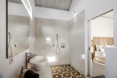 a bathroom with a sink and a shower at A Casa Di Renucci by Alfred in Bali in Seminyak